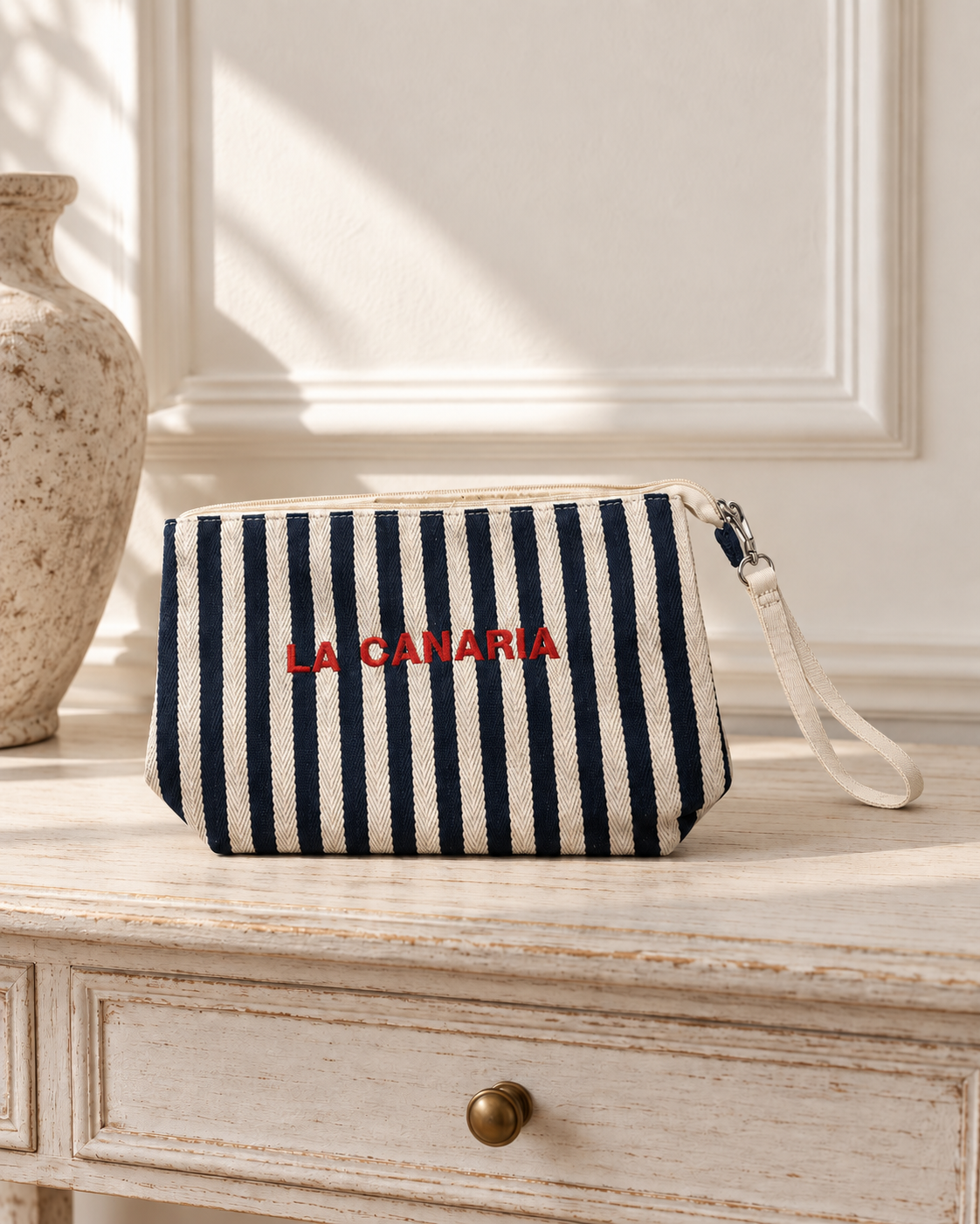 Bolso pouch de rayas